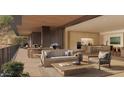 Inviting outdoor living room area with comfortable seating, dining area and mountain views at 5050 N Camelback Ridge Dr # 1301, Scottsdale, AZ 85251