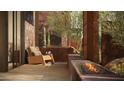 Cozy outdoor patio with modern furniture and a fire pit at 5050 N Camelback Ridge Dr # 1301, Scottsdale, AZ 85251