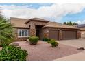 Charming single-story home featuring a three-car garage, desert landscaping, and palm trees at 5536 E Gable Ave, Mesa, AZ 85206