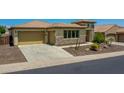 Beautiful one-story home featuring a well-maintained lawn, desert landscaping, and a private driveway at 6914 W Juana Dr, Peoria, AZ 85383