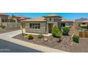 Inviting single-Gathering home featuring low-maintenance landscaping and a charming front entrance at 6914 W Juana Dr, Peoria, AZ 85383