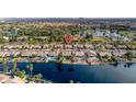 Stunning aerial view of waterfront homes along the lake, showcasing the community's prime location and serene surroundings at 835 W Beechnut Dr, Chandler, AZ 85248