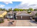 Charming single-Gathering home featuring a tile roof, well-manicured landscaping, and a two car garage at 835 W Beechnut Dr, Chandler, AZ 85248