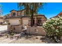 Inviting exterior view of a house with a spacious patio, perfect for outdoor relaxation at 12375 W Meadowbrook Ave, Avondale, AZ 85392