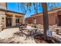 Welcoming front patio furnished with comfortable seating and adorned with charming decor at 12375 W Meadowbrook Ave, Avondale, AZ 85392