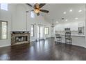 Open-concept living room showcasing a stone fireplace, high ceilings, and a breakfast bar at 15828 N 10Th Pl, Phoenix, AZ 85022