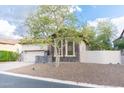 Inviting single-Gathering home with a well-manicured front yard, complemented by natural desert landscaping at 1659 N Channing --, Mesa, AZ 85207