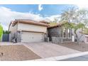 Charming single-Gathering home with a spacious two-car garage and a welcoming brick driveway in a well-maintained neighborhood at 1659 N Channing --, Mesa, AZ 85207