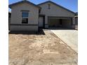 Charming single-Gathering home featuring a spacious two-car garage and low maintenance desert landscaping at 1947 E Bucking Bronco Dr, San Tan Valley, AZ 85140