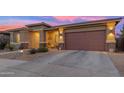 Inviting single-Gathering home featuring a two-car garage and low-maintenance desert landscaping at 22639 E Avenida Del Valle --, Queen Creek, AZ 85142