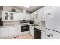 Bright kitchen featuring all white cabinets, modern appliances, and a functional layout perfect for cooking at 2400 E Baseline Ave # 169, Apache Junction, AZ 85119