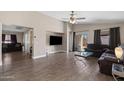 Inviting living area with wood-look tile and large windows, seamlessly flowing layout at 30100 N Sunray Dr, San Tan Valley, AZ 85143