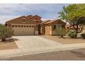 Inviting one-story home with a two-car garage, desert landscaping, and a spacious driveway at 3843 E Citrine Rd, San Tan Valley, AZ 85143