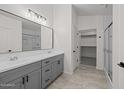 Double vanity and walk-in closet in main bathroom with a walk-in shower at 3843 E Citrine Rd, San Tan Valley, AZ 85143