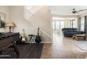 Open-concept living area showcasing neutral tones, staircase, and seamless transitions between spaces at 3952 E Frances Ln, Gilbert, AZ 85295