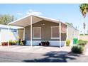 Charming home featuring desert landscaping, covered parking, and a welcoming facade at 501 E Ray Rd # 36, Chandler, AZ 85225