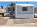 Single-story home featuring a covered porch and gravel landscaping at 535 S Alma School Rd # 37, Mesa, AZ 85210