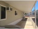 Covered parking space with beige siding and a window air conditioning unit at 535 S Alma School Rd # 37, Mesa, AZ 85210