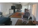 Open-concept living area with bright walls, vintage style, and modern appliances at 535 S Alma School Rd # 37, Mesa, AZ 85210