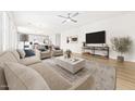 Bright and airy living room with a modern aesthetic, seamlessly connected to a stylish kitchen at 651 W Laredo St, Chandler, AZ 85225