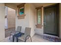 Inviting covered front porch with seating area, perfect for relaxing and enjoying the outdoors at 8905 W Jefferson St, Tolleson, AZ 85353