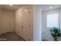 Upstairs hallway featuring neutral carpet, closet and a plant by the stairway at 8905 W Jefferson St, Tolleson, AZ 85353