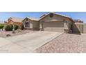 Charming single-Gathering home with desert landscaping and a two-car garage at 1564 E Leaf Rd, San Tan Valley, AZ 85140