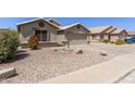 Single-Gathering home featuring a two-car garage, desert landscaping and tile roof at 1564 E Leaf Rd, San Tan Valley, AZ 85140