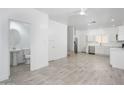 Bright and airy living space with tile floors, updated bathroom, and a seamless flow into the kitchen at 17610 N 17Th Pl # 2, Phoenix, AZ 85022