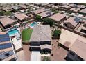 Aerial view of a suburban home featuring a private backyard with a pool and manicured lawn at 18351 W Southgate Ave, Goodyear, AZ 85338