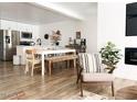 Modern living area showcasing wood floors, an open floor plan, and stylish, neutral decor with abundant natural light at 20 S Buena Vista Ave # 111, Gilbert, AZ 85296
