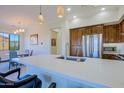 Bright kitchen boasts a center island, stainless appliances, and adjacent dining area at 20750 N 87Th St # 2115, Scottsdale, AZ 85255