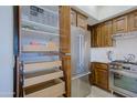 Well-organized kitchen with wood cabinets, stainless steel appliances, and a convenient pull-out pantry at 20750 N 87Th St # 2115, Scottsdale, AZ 85255