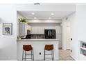 Modern kitchen with sleek cabinetry, granite countertops, and stainless steel appliances at 2201 N Comanche Dr # 1093, Chandler, AZ 85224