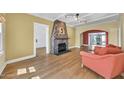 Bright living room featuring a stone fireplace, hardwood floors, and neutral color palette at 2546 N 9Th St, Phoenix, AZ 85006