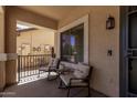 Cozy front porch area featuring comfortable seating, providing a relaxing outdoor space at 27420 N 63Rd Dr, Phoenix, AZ 85083