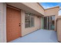 Private patio featuring a painted concrete floor, a sliding glass door, and a secure front entry at 2834 S Extension Rd # 2005, Mesa, AZ 85210