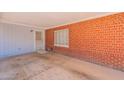 Covered carport featuring a secure entrance and window to the main property at 3115 N 26Th St, Phoenix, AZ 85016