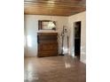 A clean dining room with wood floors and hutch, awaiting personalization to create a warm, inviting space at 3115 N 26Th St, Phoenix, AZ 85016