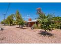 A charming red-brick home with desert landscaping and mature trees at 3115 N 26Th St, Phoenix, AZ 85016