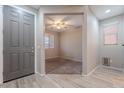 Inviting entryway features stylish wood-look tile flooring and a glimpse into a carpeted living area at 316 N 78Th Pl, Mesa, AZ 85207