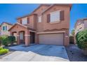 Beautiful home showing a spacious driveway, an attached two-car garage, and a covered front porch at 316 N 78Th Pl, Mesa, AZ 85207