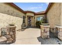 Inviting front courtyard featuring decorative stone pillars and desert landscaping at 32819 N 23Rd Ave, Phoenix, AZ 85085