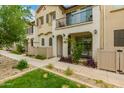 Exterior view of townhomes featuring stucco facades, balconies, and neat landscaping at 4637 S Jetty --, Mesa, AZ 85212