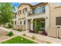 Charming townhome exteriors with balconies, desert landscaping, and pedestrian-friendly walkways at 4637 S Jetty --, Mesa, AZ 85212