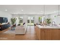 Open-concept living space with access to backyard and kitchen at 5537 E Earll Dr, Phoenix, AZ 85018
