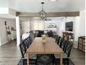 Bright dining area with an open floor plan, stylish decor, and modern finishes throughout the home at 694 W Park Ave, Chandler, AZ 85225
