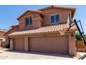 Close up of front of two story home with basketball hoop in sunny weather at 7179 W Surrey Ave, Peoria, AZ 85381