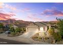Charming single-story home with desert landscaping, mountain views, and an attached two-car garage at 7577 S Towel Creek Dr, Gold Canyon, AZ 85118