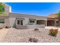 Charming single-story home with desert landscaping and a covered parking area at 7736 E Rancho Vista Dr, Scottsdale, AZ 85251
